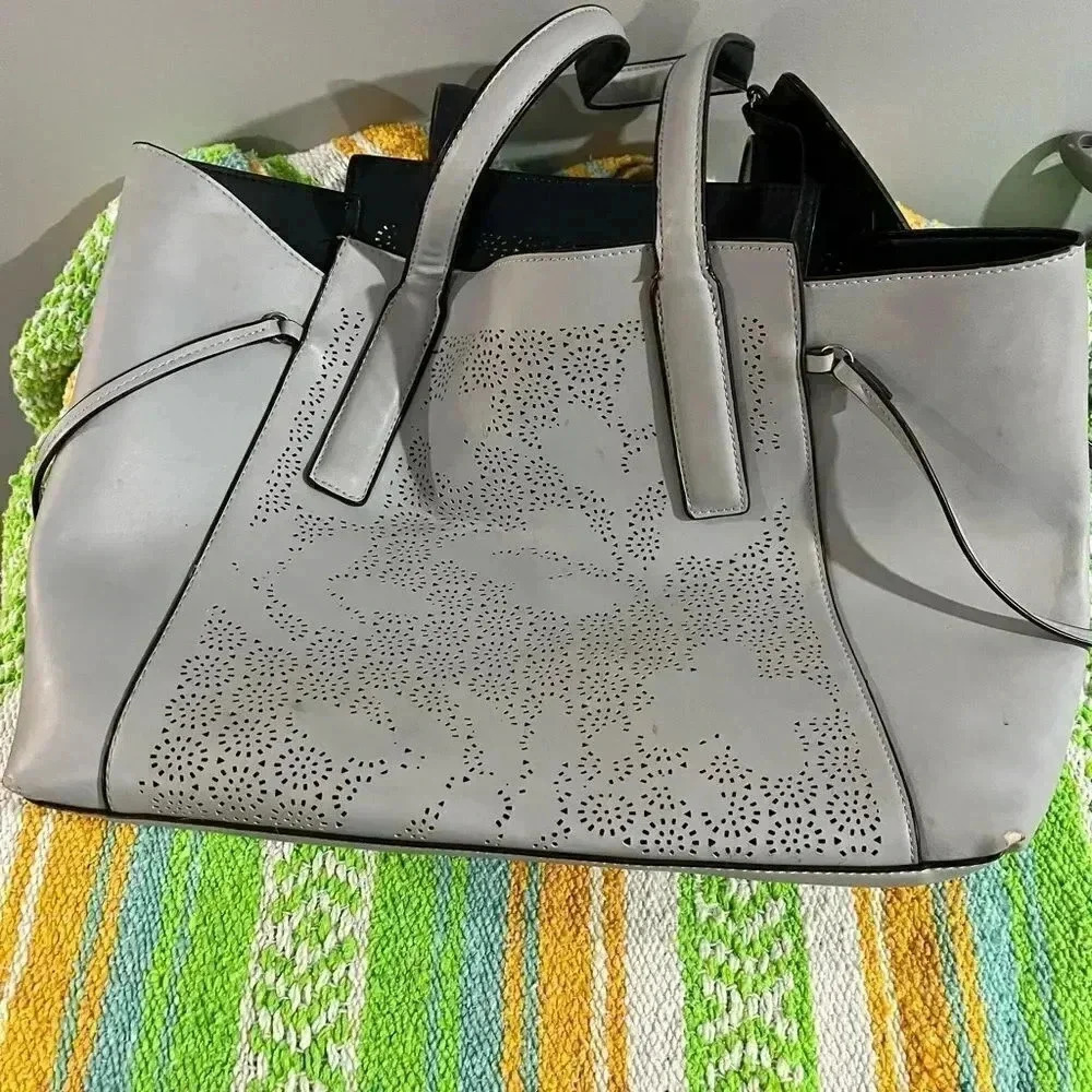 Beautiful faux leather laser cut tote with attached inside bag GUC